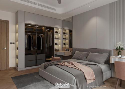 a master bedroom with a bed and a closet at The Quartz Horizon Hanoi-Elegant Hideout with Rooftop Access-Coffee 24-7 in Hanoi
