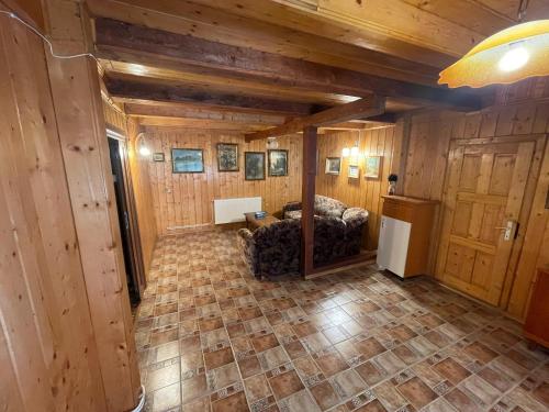 an overhead view of a living room with wood paneling at Cabană cu gradină in Iași-Bârnova in Bîrnova