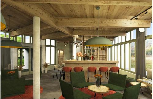 een lobby met een bar met groene stoelen en een tafel bij WALDGUT Naturresort in Bad Gottleuba