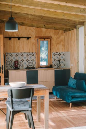 a living room with a table and a couch at miCielo - Baumhäuser in Vejer de la Frontera