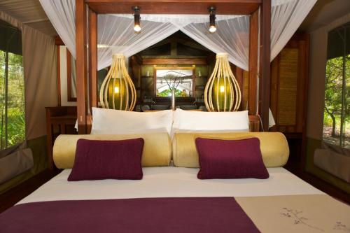 Voodi või voodid majutusasutuse Mara Intrepids Tented Camp toas