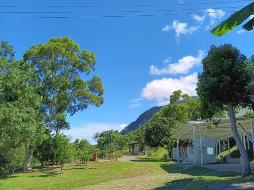 a view of a house with mountains in the background at 高一 33 班 Homestay 1982 in Chenggong