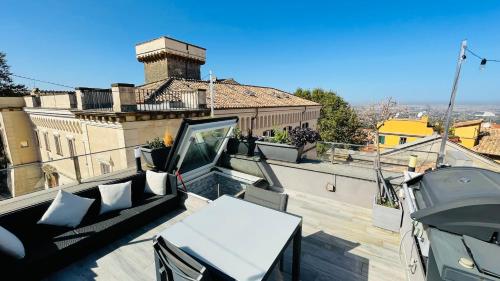 a balcony with a table and a view of a building at Frascati Tower B&B in Frascati