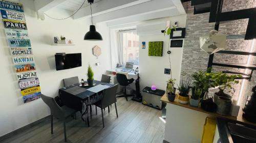 a dining room with a table and a desk at Frascati Tower B&B in Frascati