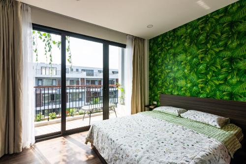 Postel nebo postele na pokoji v ubytování Coast Pearl Hotel & Apartment - Free Airport PickUp