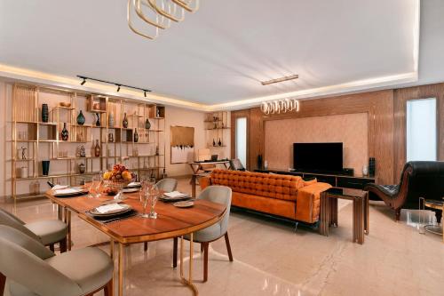 a living room with a table and a couch at Pickalbatros Citadel Resort Sahl Hasheesh in Hurghada