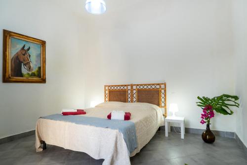 Katil atau katil-katil dalam bilik di Agro Antico B&b