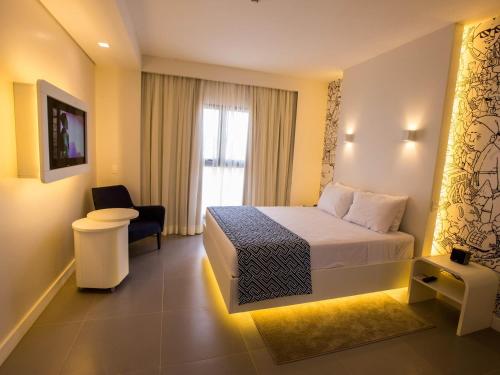 ibis Styles Parauapebasにあるテレビまたはエンターテインメントセンター