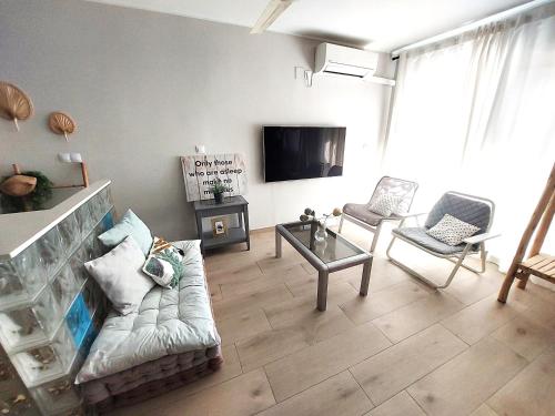 TV a/nebo společenská místnost v ubytování Golf & Playa a 1 min