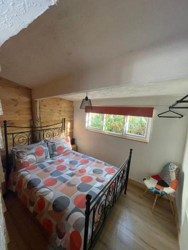 a bedroom with a bed and a window at The Wendy house in Parkend