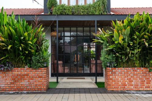 a building with some plants in front of it at Chrisenbel Hideaway Retreat in Petaling Jaya
