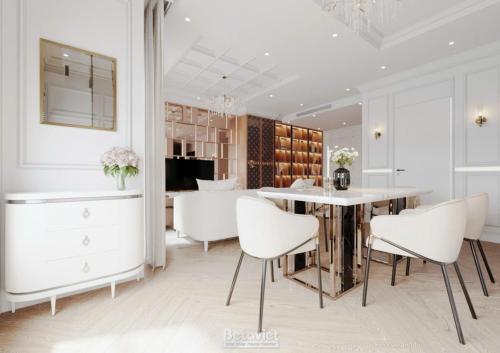 Un comedor con una mesa y sillas blancas. en The Celestial Reef Hanoi-Stylish Stay with Rooftop Pool & Free Laundry-Middle Old Quarter, en Hanói