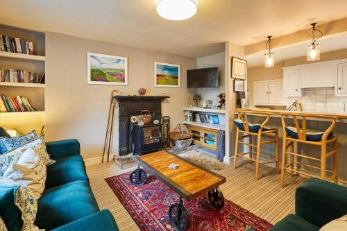 a living room with a couch and a table at Host & Stay - Rosella Cottage in Pickering