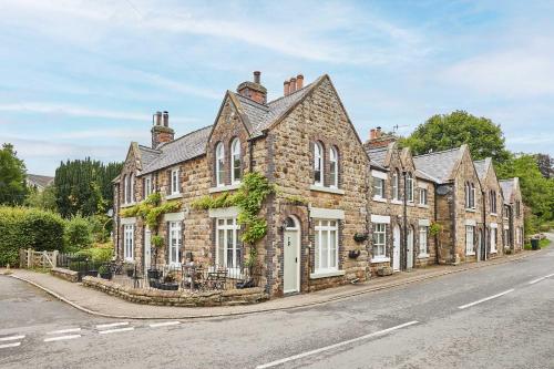 an old stone house on the side of a street at Host & Stay - Rosella Cottage in Pickering