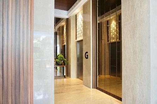 a hallway of a building with the letter c on it at The Malioboro Hotel & Conference Center in Yogyakarta