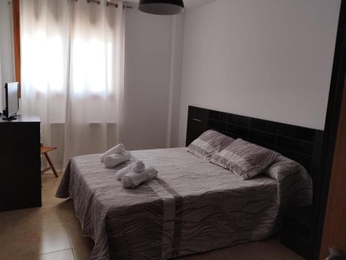 Ένα ή περισσότερα κρεβάτια σε δωμάτιο στο La Parada de Calanda