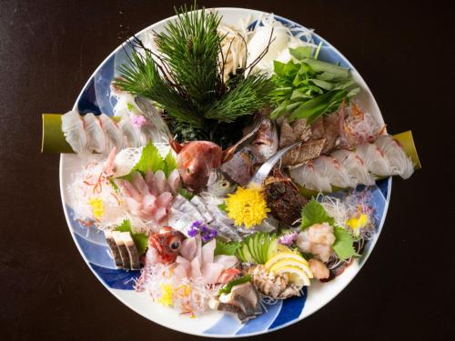 a plate of food with seafood on a table at Awakan in Sumoto