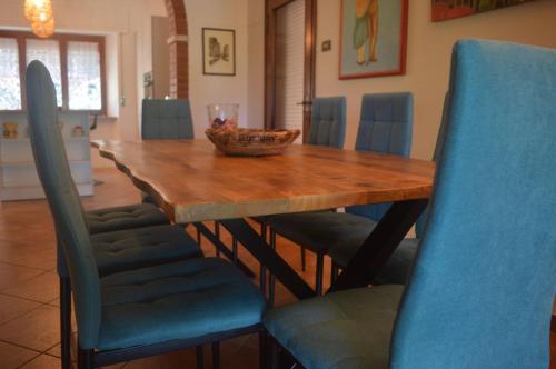 a dining room table with chairs and a bowl on it at Villetta la Fortezza in Radicofani