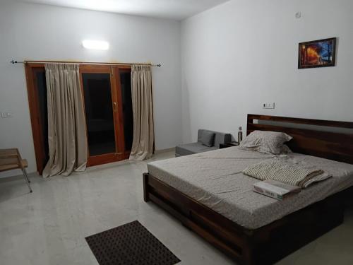 Cama o camas de una habitación en Thondalli Villa