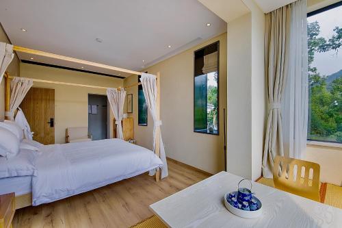 Postel nebo postele na pokoji v ubytování Green Sleeves B&B, Hangzhou