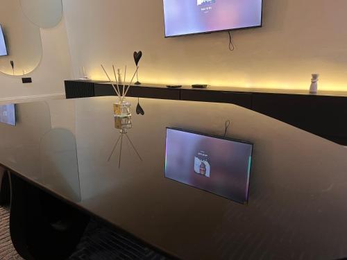 a table with a tv on top of it at Luxury 2bedroom Apt in lekki,24hrs light, Wifi in Lekki