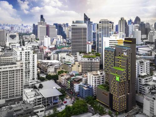 an aerial view of a city with tall buildings at Novotel Bangkok Sukhumvit 4 in Bangkok
