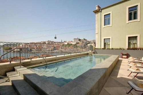 a swimming pool on the roof of a building at Origine Porto Gaia, a Tribute Portfolio Hotel in Vila Nova de Gaia