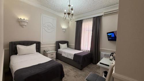 Ένα ή περισσότερα κρεβάτια σε δωμάτιο στο Hotel Butique Biluri S