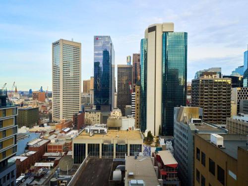 a view of a city skyline with tall buildings at ibis Melbourne Central in Melbourne