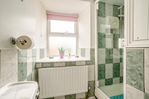 a bathroom with a sink and a toilet and a window at 2 Bed in Wellingtonbridge oc-ii03414 in Nelson Bridge