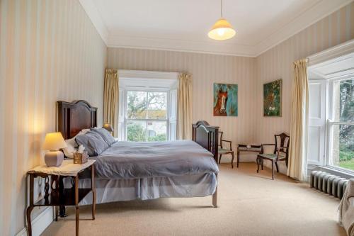 a bedroom with a bed and a table and chairs at 3 Bed in Enniscorthy oc-ii16584 in Enniscorthy
