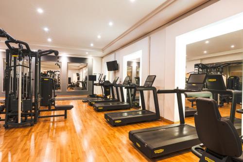 a gym with a row of treadmills and ellipticals at Hyatt Regency Belgrade in Belgrade