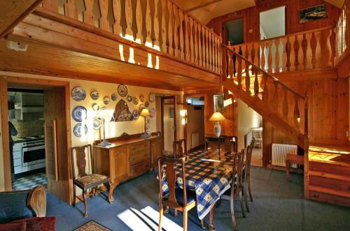 a dining room with a table and a staircase at 4 Bed in Carne oc-i023 in Carne