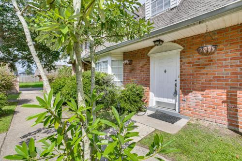 a brick house with a white door and a tree at 23 Mi to NOLA Cozy and Quaint Destrehan Townhome in Destrehan