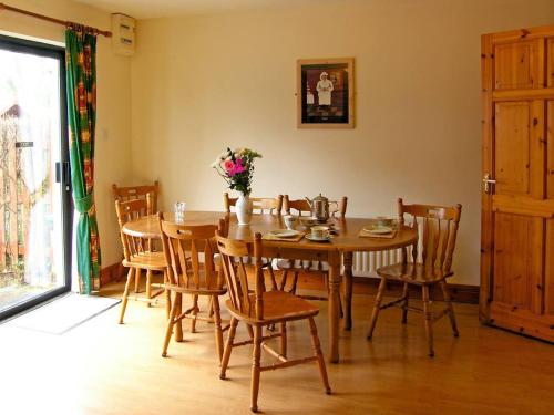 a dining room with a wooden table and chairs at 4 Bed in Westport oc-ii12085 in Westport