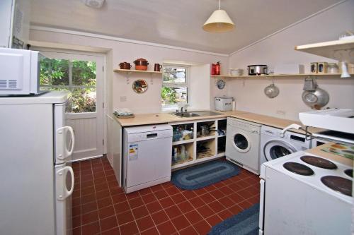 a kitchen with a washer and dryer in it at 4 Bed in Renvyle oc-i258 in Salrock