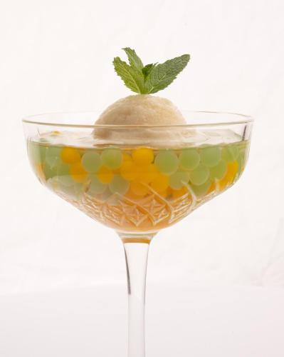 a martini glass with a lime on top of it at Hotel Polski Pod Białym Orłem in Kraków
