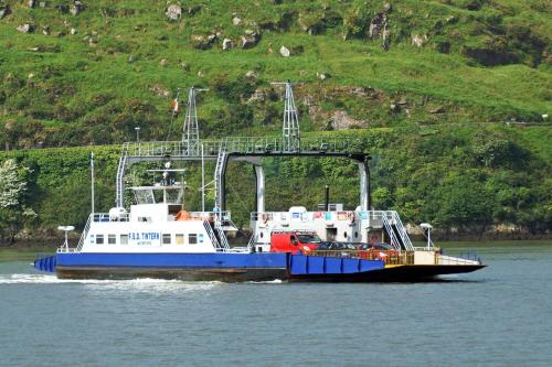 a large blue and white boat on the water at 3 Bed in Duncannon oc-i041 in Duncannon