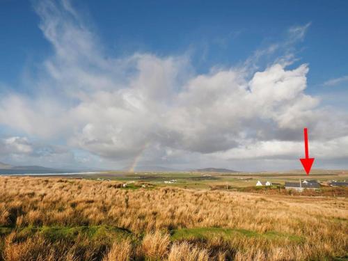 a red arrow in a field with a rainbow in the sky at 3 Bed in Louisburgh oc-ii06694 in Killeen