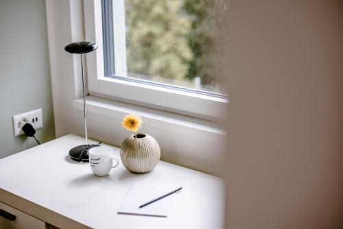 a vase sitting on a counter next to a window at THE FLAG Zürich in Zürich
