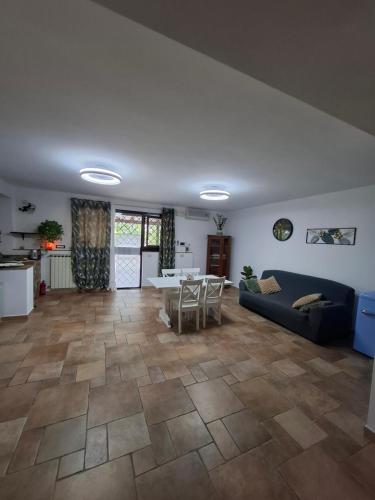 a living room with a couch and a table at La Casa di Mia in Monterotondo