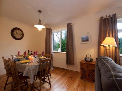 a dining room with a table and a couch at 3 Bed in Spiddal oc-ii14643 in Caher