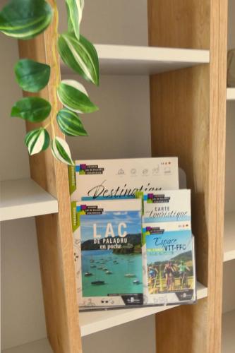 a stack of books on a book shelf at L'HACIENDA DUO a romantic getaway with a private spa in Charavines