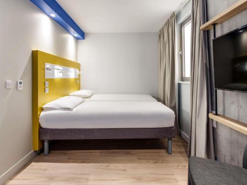 Postel nebo postele na pokoji v ubytování ibis budget Swindon