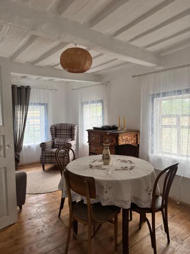 a dining room with a table and chairs at Бабусина хатка in Leplyavo