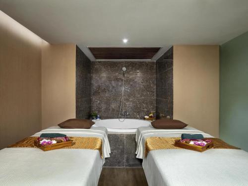 Mercure Jakarta Bataviaにあるベッド