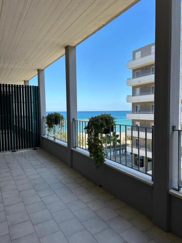 a balcony with a view of the beach at Bari Double Sea View in Bari