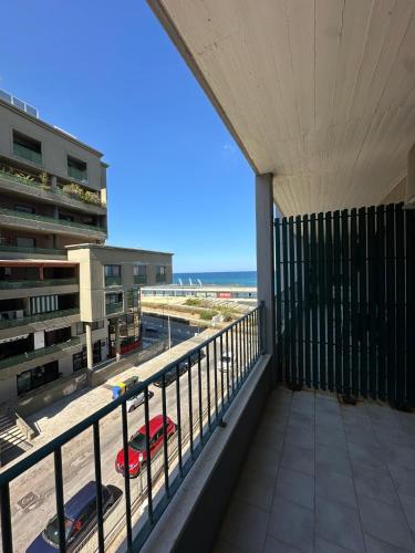 a balcony with a view of the beach at Bari Double Sea View in Bari