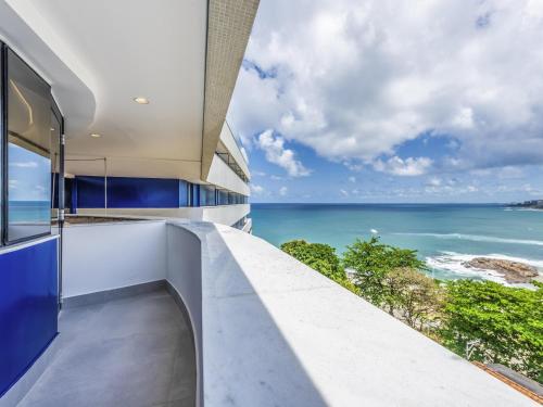 a kitchen with a view of the ocean at Novotel Salvador Rio Vermelho in Salvador
