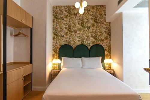En eller flere senge i et værelse på Hotel Accademia